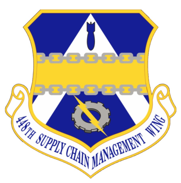 Logo der 48. Versorgungsmanagementstaffel mit einem blauen Schild mit einem weißen Stern, einem weißen Banner mit blauer Schrift "Versorgungsmanagement" und schwarzer Schrift "48. Versorgungsmanagementstaffel" in fetter Schrift.