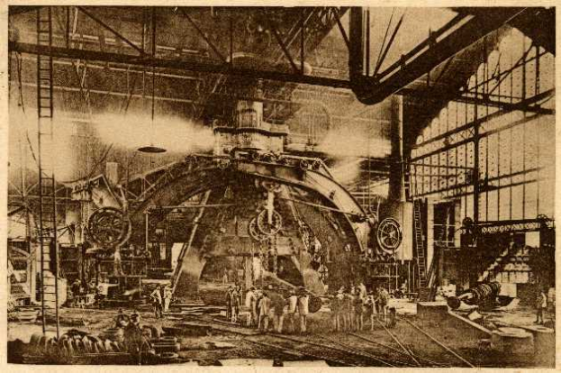 Ein Schwarz-Weiß-Foto eines Fabrikinneren mit Arbeitern, die eine große Maschine bedienen, umgeben von Leitern und Stangen, mit dem Text "Cadillac Steel Works" unten.