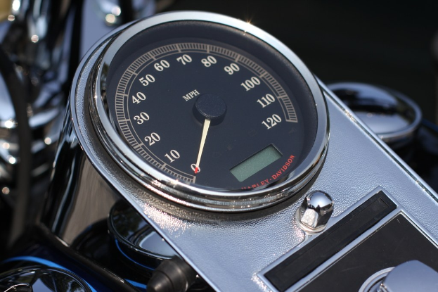 Tachometer on a motorcycle dashboard.