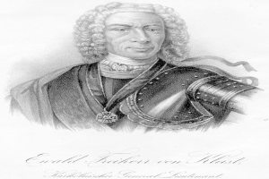 Ein Schwarz-Weiß-Zeichnung eines Mannes in Rüstung, identifiziert als Ewald Freiherr von Kleist, ein deutscher Generaloberst, der eine Medaille um den Hals trägt, mit Text unten, der sein Leben und seine Leistungen beschreibt.