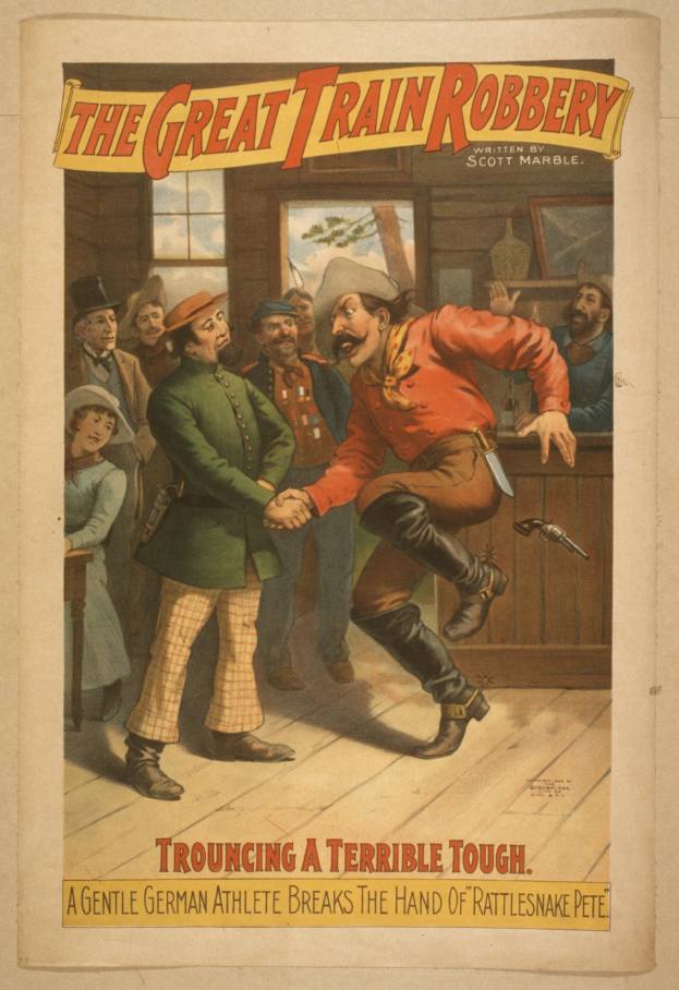 Ein Plakat, das eine Gruppe von Menschen auf einem Boden zeigt, einer hält eine Waffe, mit Text oben und unten: "Die große Zugüberfall - Trouching ein Schreckliches Tough".