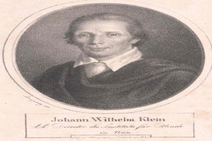 Schwarzes und weißes Porträt von Johann Wilhelm Klein, Direktor des Instituts für Blinde in Wien, der einen weißen Hemdkragen trägt und ernst schaut, mit deutschem Text unten.